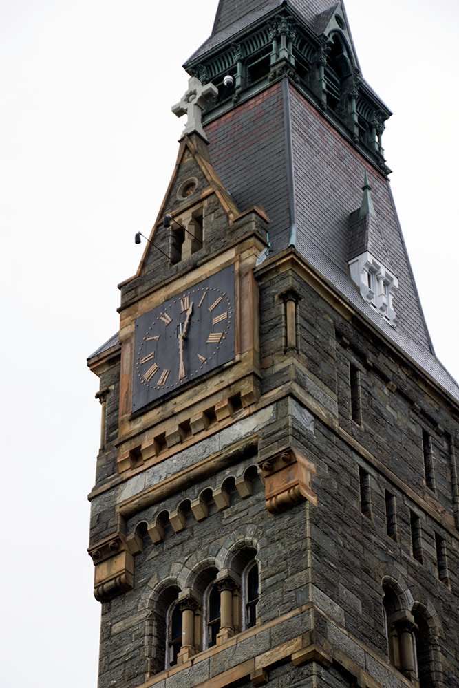 Healey clock tower with the hands positioned around 12:30.