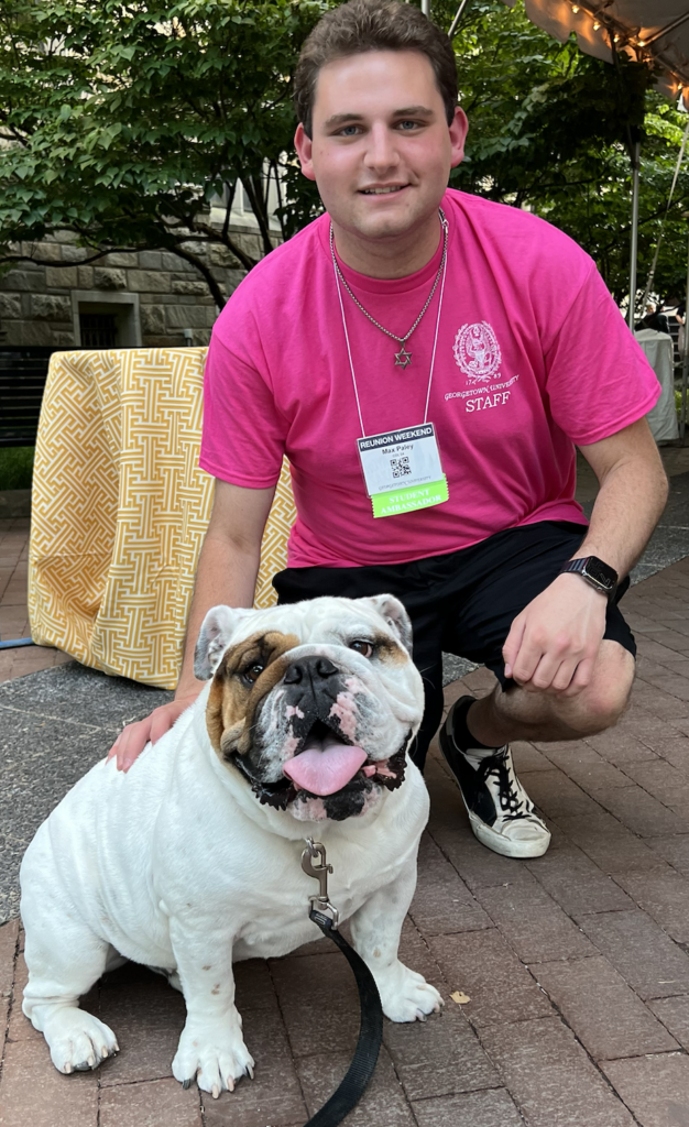 Headshot of Max Paley with Jack the Bulldog